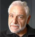 A person with white hair and beardAI-generated content may be incorrect.